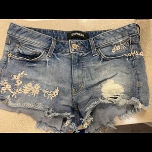 Express floral embroidered cut off jean shorts